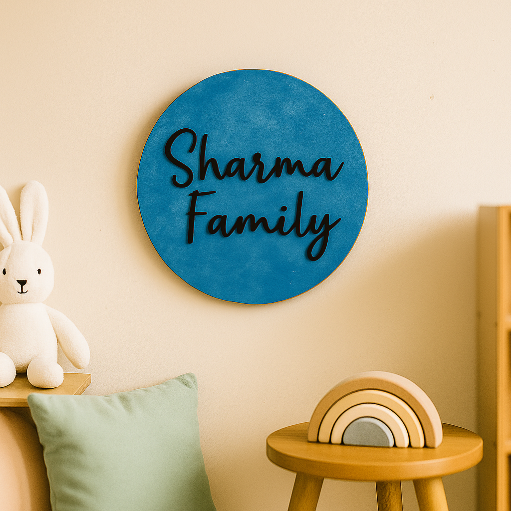 MDF Round blue sign with 'Sharma Family' text on a wall with decorative items.