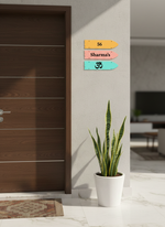 Decorative nameplate with symbols on a wall next to a door