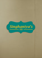 Beige box with a teal decorative label featuring 'Singhaniya's' in yellow text.