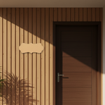 Wooden door and wall with a decorative nameplate on a wooden wall