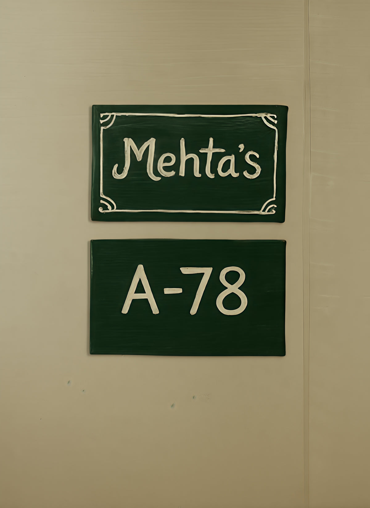 Two green signs with white text on a beige wall, one reading 'Mehta's' and the other 'A-78'.