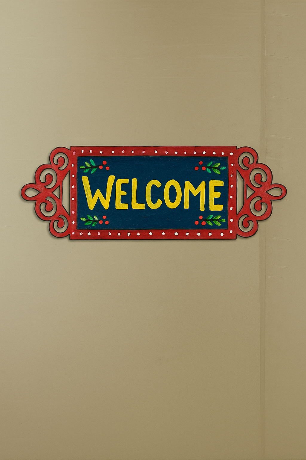 Decorative 'Welcome' sign with a red border on a beige wall.