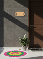 Decorative colorful mat on a floor with a door and plant in the background