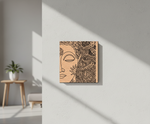 Decorative MDF DIY wall art of a stylized face with intricate patterns on a beige background, hanging on a light gray wall.