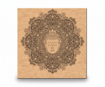 Decorative MDF DIY wall art with Buddha face and mandala design on a brown paper background