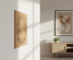 MDF DIY wall art piece on a white wall with a blurred background of a living room.