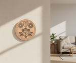 Decorative MDF DIY wall plaque with symbols on a beige wall in a living room.