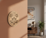 Decorative MDF DIY wall art with floral design on a beige wall, room setting with furniture and plant.
