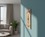 Decorative MDF DIY  wall art on a teal wall with a blurred living room in the background