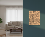 Decorative MDF DIY wall art on a teal wall with a living room in the background