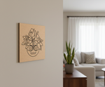 MDF DIY wall art with a floral design on a beige wall in a living room.