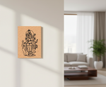 MDF DIY  wall art with a black design of a deity on a light-colored wall.