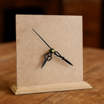 Table clock on a stand with a neutral background