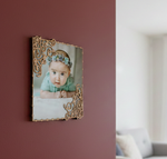 photo frame of a baby with decorative frame on a wall
