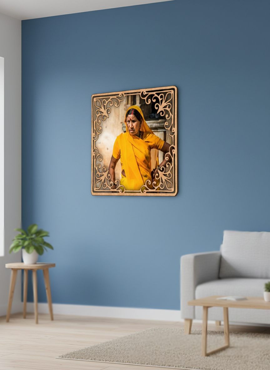 Woman in yellow dress framed artwork on a blue wall with a gray sofa and wooden side table.