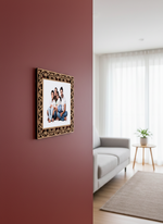 photo frame family photo on a red wall in a living room with a gray sofa and white curtains.