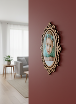 Decorative photo frame with a portrait on a red wall, living room visible in the background