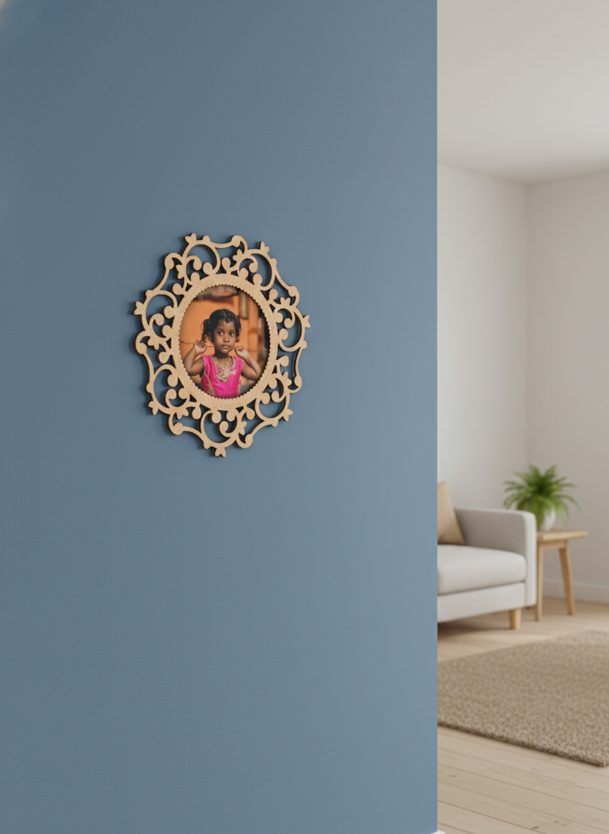 Decorative photo frame with a photo of a child on a blue wall in a room with a couch and plant.