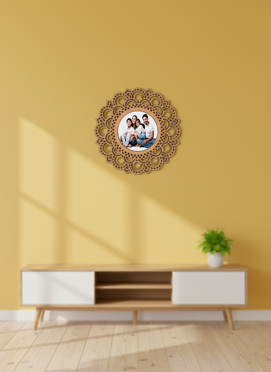 Decorative photo frame with a family photo on a yellow wall above a wooden entertainment console.