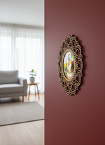 Decorative photo frame with floral design on a maroon wall in a living room.