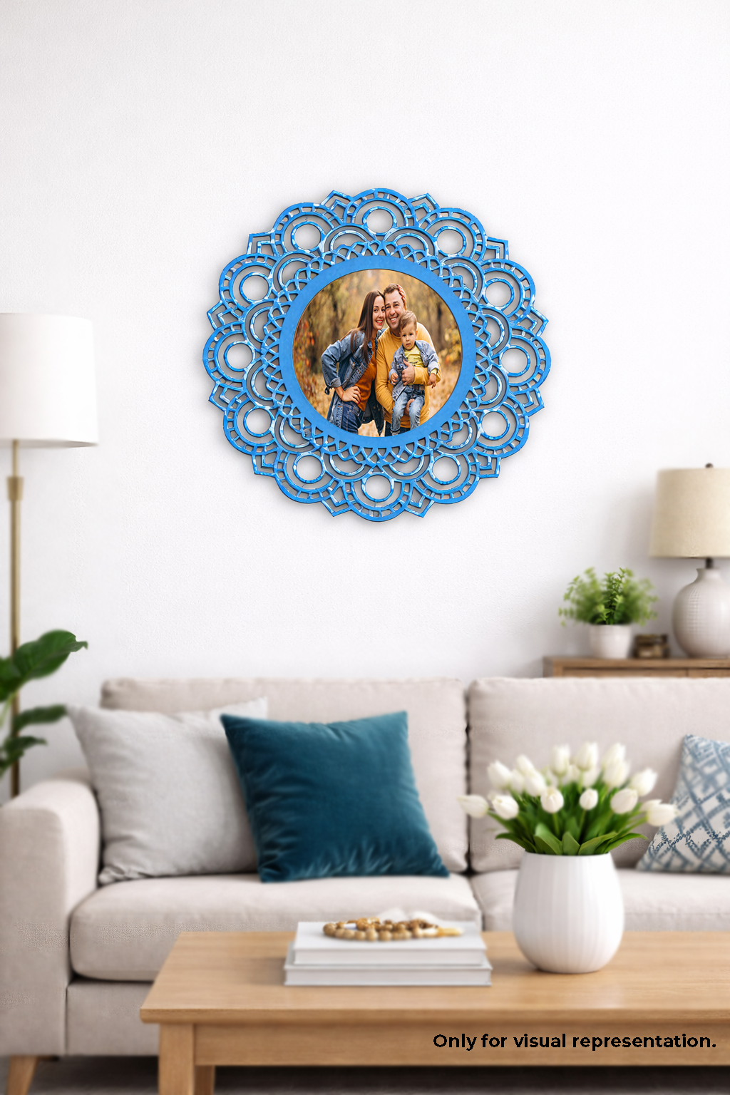 Decorative blue wall photo  frame with a photo of a couple on a white wall above a sofa.