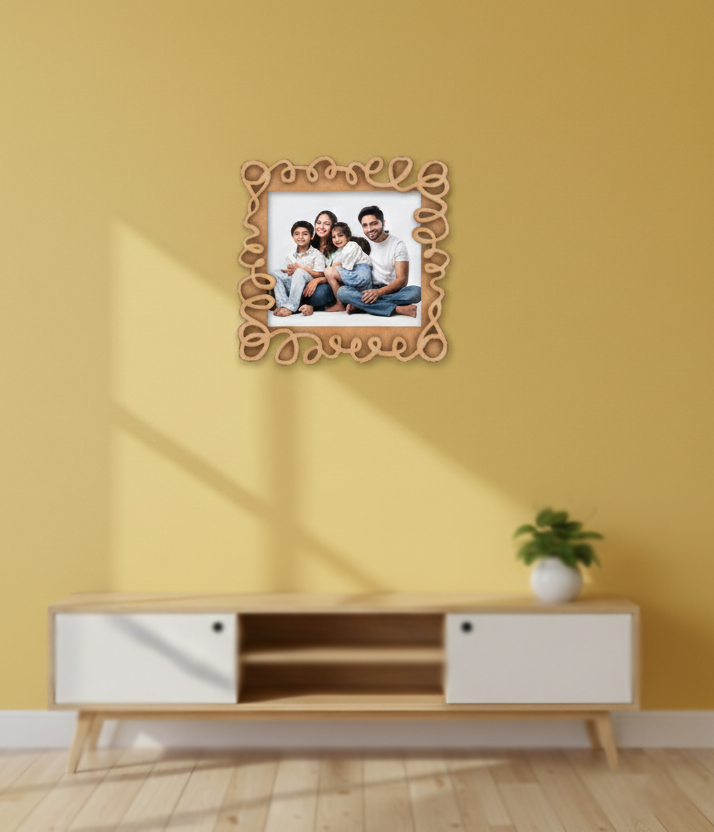 Decorative photo frame with a family portrait on a yellow wall above a wooden cabinet.