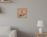 Wooden picture frame with a baby and teddy bear on a wall in a living room.