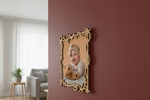 Decorative photo frame with a child holding a teddy bear in a living room setting.