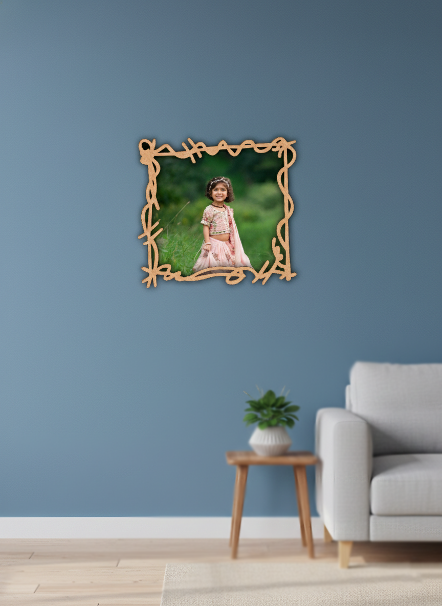 Framed photo of a child on a blue wall above a sofa and side table.