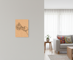 Decorative  MDF DIY wall art on a gray wall in a living room with a couch and coffee table.