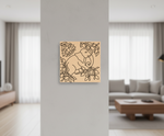 Decorative  MDF DIY wall art of an elephant with flowers on a gray wall in a living room.