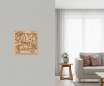 Decorative floral  MDF DIY wall art on a gray wall in a living room.