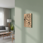  MDF DIY  wall art of a stylized face on a light green wall in a living room.