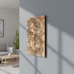  MDF DIY  wall art with intricate designs of two faces on a gray wall in a living room.