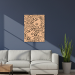 Decorative MDF DIY wall art with intricate designs on a blue wall above a white sofa.
