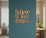 Unpainted MDF Believe In Your Dreams quote DIY cutout for wall decor and crafts, mounted on wall