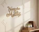 Unpainted MDF Treasure This Moment quote DIY cutout for wall decor and craft projects, mounted on wall