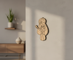 MDF DIY wall decoration of a cartoon character on a neutral wall.