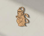 MDF DIY figurine of a sitting figure with a crown on a light gray background
