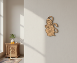 MDF DIY wall decoration of a seated figure on a white wall with natural light.