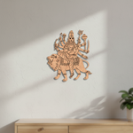  MDF DIY wall art of a deity on a lion against a white wall with a plant in the corner.