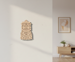 MDF DIY  wall art with geometric design on a white wall, next to a blurred room interior.