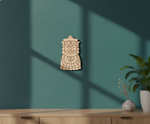  MDF DIY  wall art with a face design on a teal wall