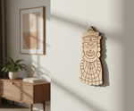  MDF DIY  wall art of a face on a white wall with a sideboard and plant in the background