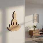  MDF DIY  wall sculpture of a meditating figure on a white wall with a blurred room background