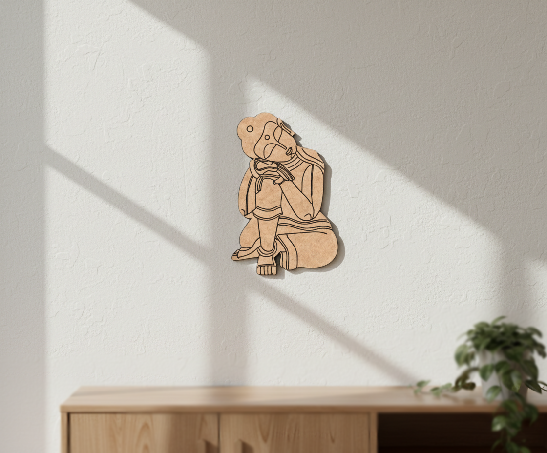  MDF DIY  wall art of a person sitting on a white wall with a plant in the corner