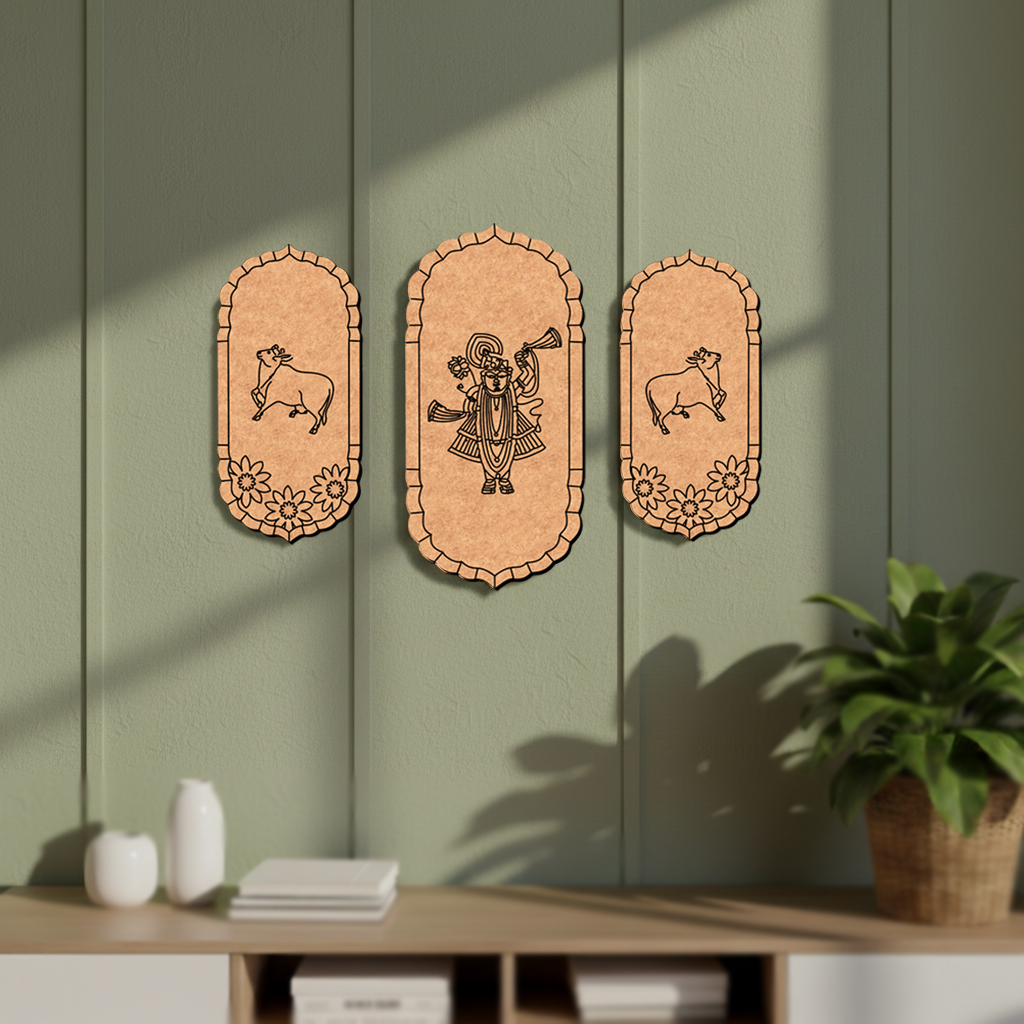 Three decorative  MDF DIY  wall hangings on a green wall with a plant and shelf in the foreground.