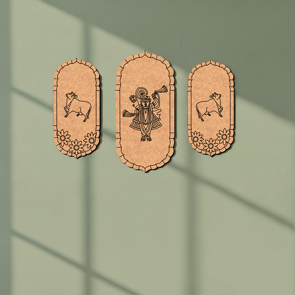 Three decorative panels with engraved designs on a green background