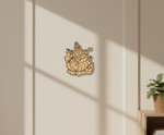 Decorative  MDF DIY wall art of a mythical creature on a beige wall with a plant in the corner.