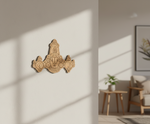 Decorative  MDF DIY wall piece on a white wall with a blurred living room in the background